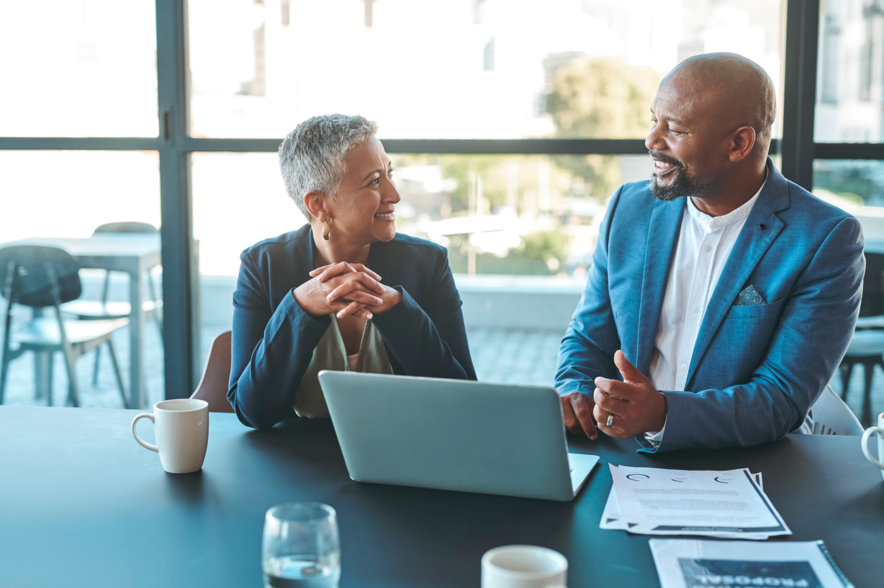 Leadership, management and teamwork between CEO and senior manager in a business meeting in the office. Leader and boss working as a team to plan the vision and mission for growth and development stock photo