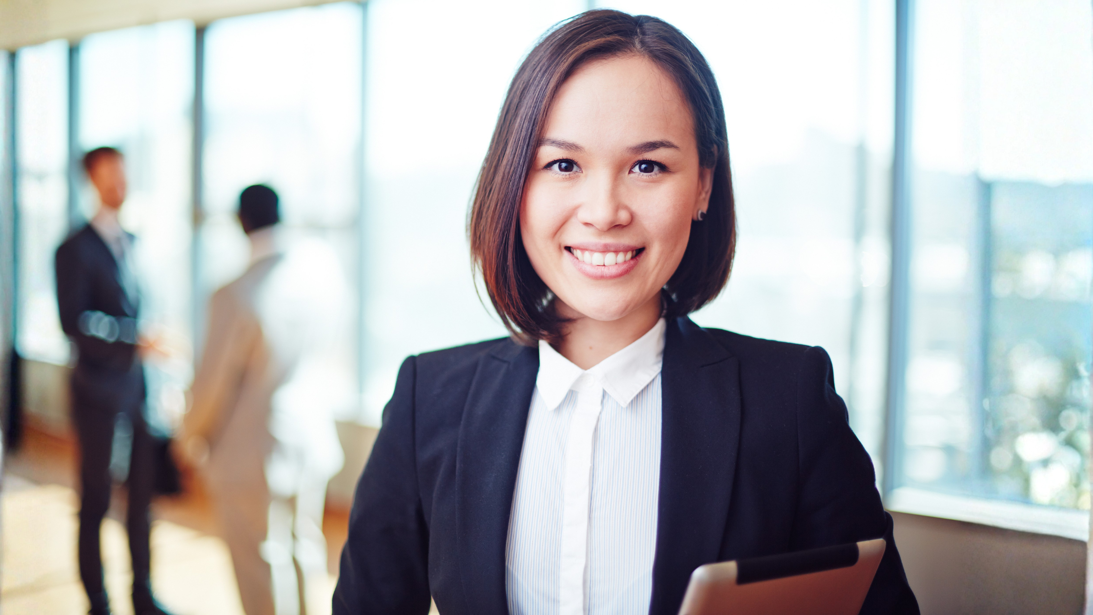 Female corporate leader with a friendly but toothy smile